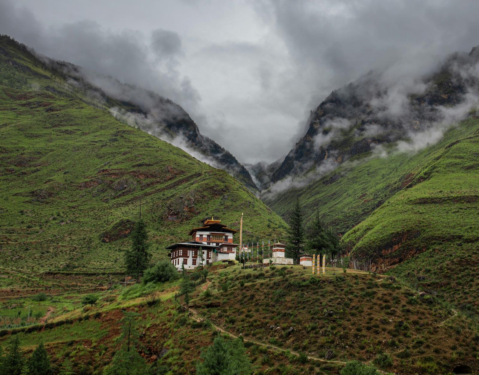 The road climbing into Bhutan’s forested mountains